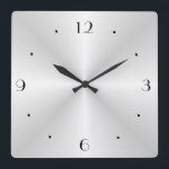 Very Plain Silver > Wall Clock<br><div class="desc">A very plain silver wall clock with black numerals and silver/black hands. Simpistic and minimal, this clock would suit the kitchen or lounge area.</div>