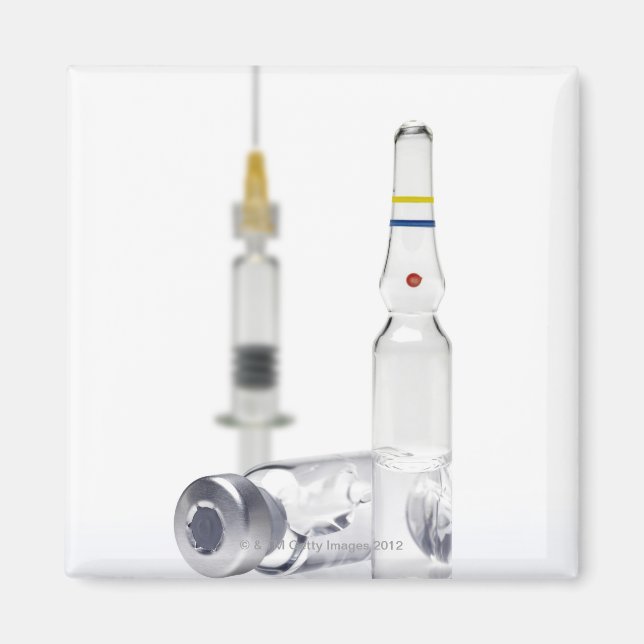 Vials containing medicine for injections and magnet (Front)