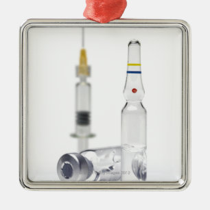Vials containing medicine for injections and metal ornament