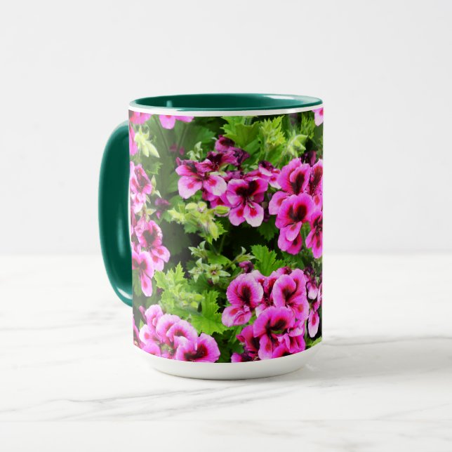 "Vibrant Blooms: Hot Pink Geraniums on Lush Bush Mug (Front Left)