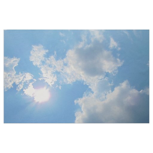 Vibrant blue sky with sun and clouds photo fabric