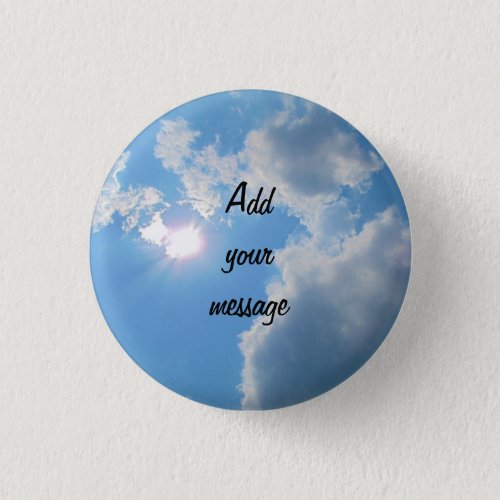 Vibrant blue sky with sun and clouds photo pinback button