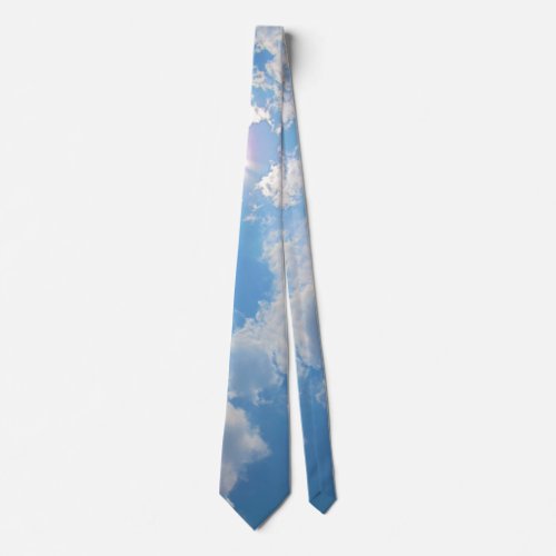 Vibrant blue sky with sun and clouds photo tie