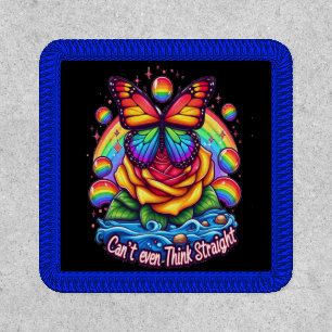 Vibrant Butterfly Perched on Colorful Rose Patch