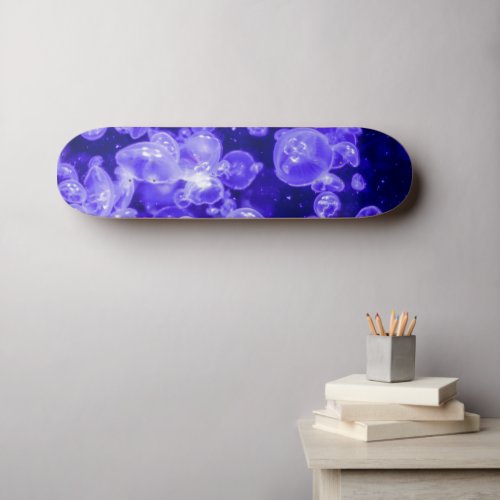 Vibrant Glowing Nautical Jellyfish Swarm Skateboard