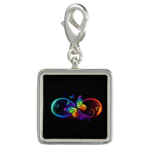 Vibrant infinity with rainbow butterfly on black charm