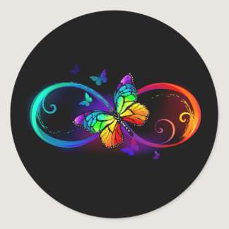 Vibrant infinity with rainbow butterfly on black classic round sticker