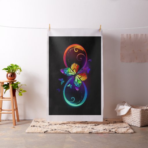 Vibrant infinity with rainbow butterfly on black fabric