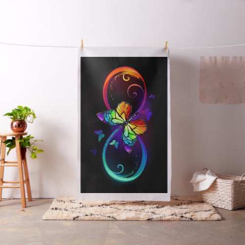 Vibrant infinity with rainbow butterfly on black fabric