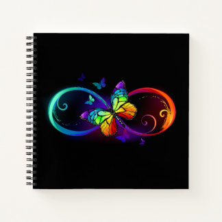 Vibrant infinity with rainbow butterfly on black  notebook