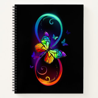 Vibrant infinity with rainbow butterfly on black notebook