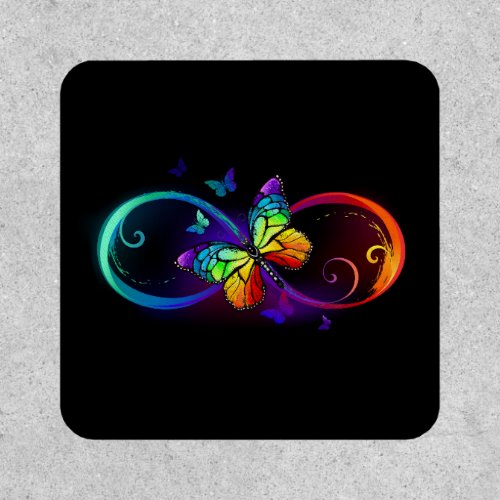 Vibrant infinity with rainbow butterfly on black patch