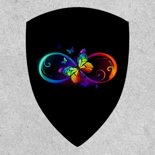 Vibrant infinity with rainbow butterfly on black patch