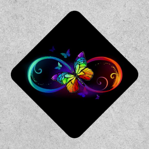 Vibrant infinity with rainbow butterfly on black patch