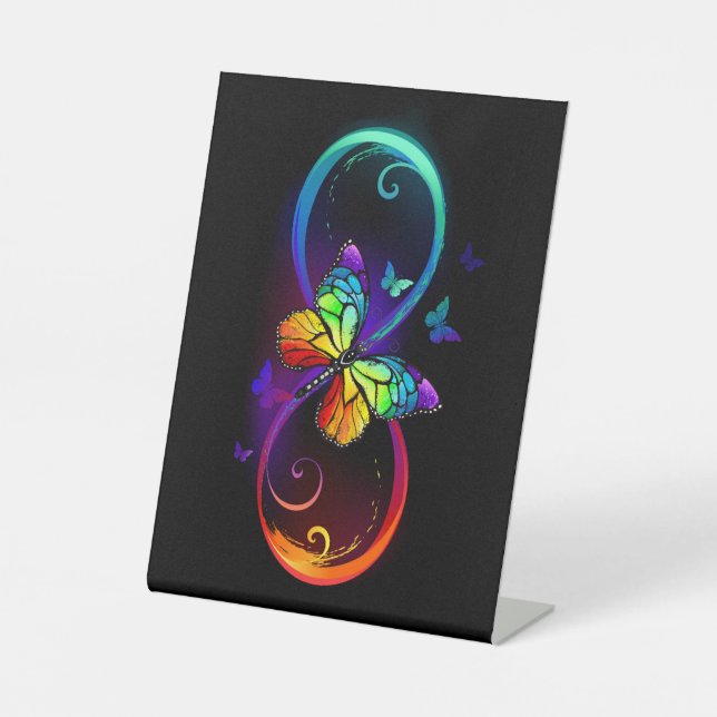 Vibrant infinity with rainbow butterfly on black pedestal sign (Front)