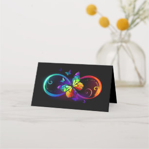 Vibrant infinity with rainbow butterfly on black place card