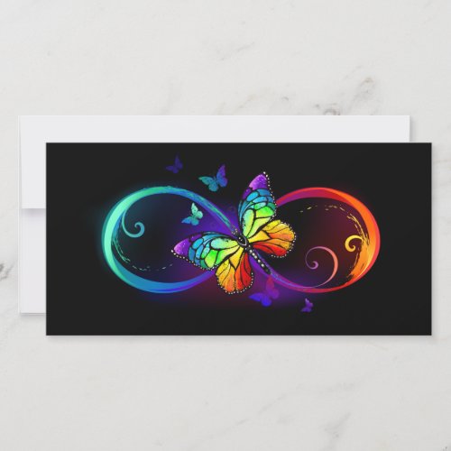 Vibrant infinity with rainbow butterfly on black  save the date