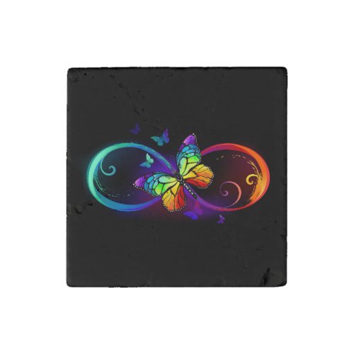 Vibrant infinity with rainbow butterfly on black stone magnet