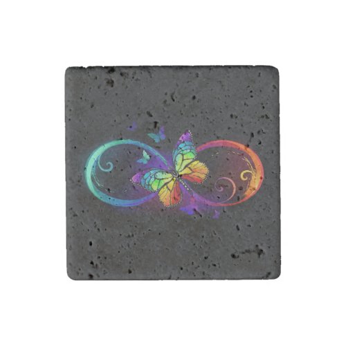 Vibrant infinity with rainbow butterfly on black stone magnet