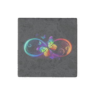 Vibrant infinity with rainbow butterfly on black stone magnet