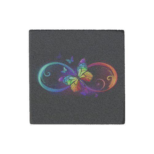 Vibrant infinity with rainbow butterfly on black stone magnet