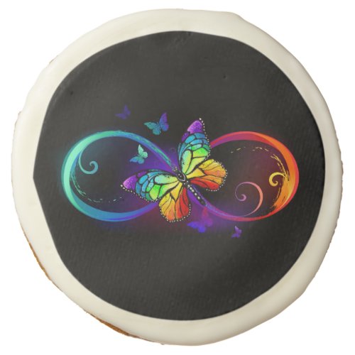 Vibrant infinity with rainbow butterfly on black sugar cookie