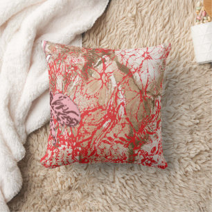 Vibrant red fabric design featuring intricate flor throw pillow
