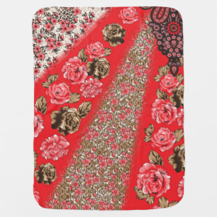 Vibrant red fabric featuring intricate floral and baby blanket