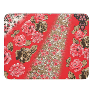Vibrant red fabric featuring intricate floral and door sign