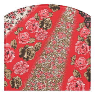 Vibrant red fabric featuring intricate floral and door sign