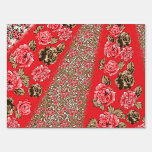 Vibrant red fabric featuring intricate floral and sign
