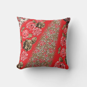 Vibrant red fabric featuring intricate floral and throw pillow