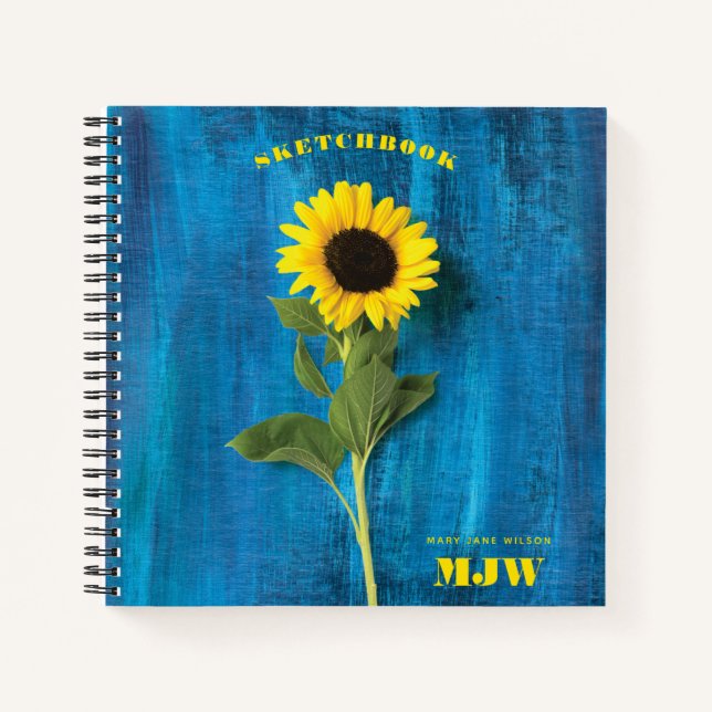 Vibrant Sunflower and Monogram on Blue Background Notebook (Front)