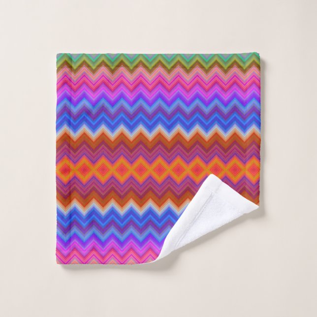 Vibrant towels hang on a rod, featuring a colorful (Wash Cloth)