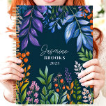 Vibrant Tropical Floral Custom Name Planner<br><div class="desc">This vibrant design showcases a lush tropical floral arrangement with colorful foliage and berries in shades of purple, orange, green, and blue, set against a deep navy background. The personalized name and year add a stylish and unique touch, making it perfect for nature lovers, students, or professionals. Ideal for organizing...</div>