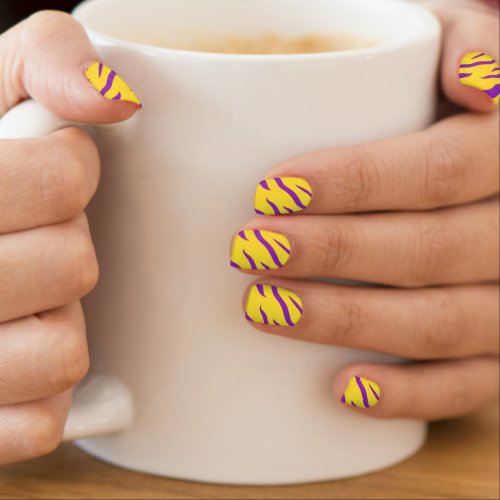 Vibrant yellow purple animal print minx nail art