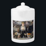 Victorian Barmaid Girl at Folies Bergere, France Teapot<br><div class="desc">Suzanne, with her fiery red hair and a gaze that could hold both amusement and a hint of melancholy, leaned against the cool marble counter. Her uniform, a black dress with a white collar that dipped low in the back, accentuated the curve of her waist. Despite the constant murmur of...</div>