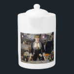 Victorian Barmaid Girl at Folies Bergere, France Teapot<br><div class="desc">Suzanne, with her fiery red hair and a gaze that could hold both amusement and a hint of melancholy, leaned against the cool marble counter. Her uniform, a black dress with a white collar that dipped low in the back, accentuated the curve of her waist. Despite the constant murmur of...</div>