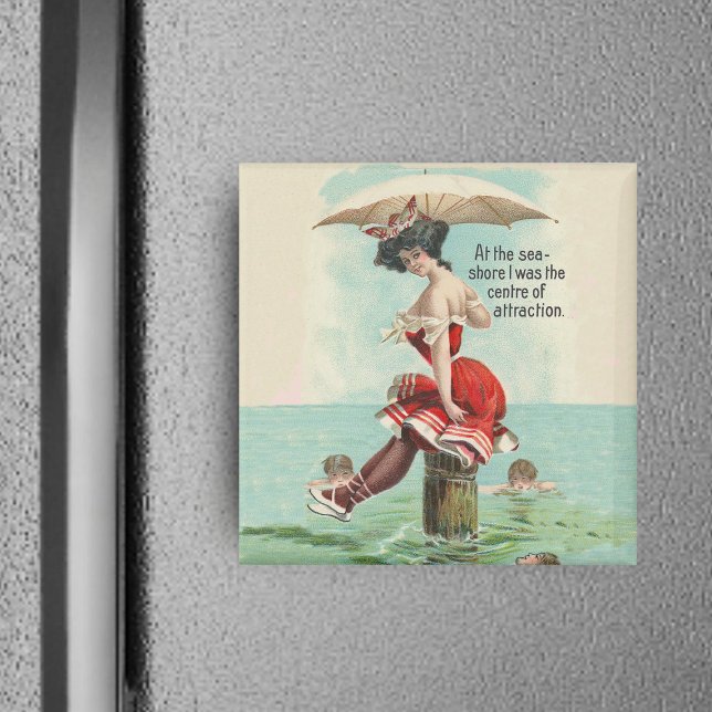 Victorian Bathing Beauty Magnet (Victorian lady in red bathing suit with parasol on log in ocean with admirers on square magnet.)