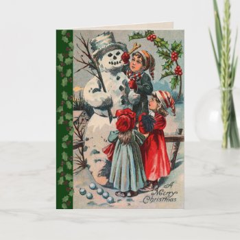 Victorian Children Building A Snowman Holiday Card by xmasstore at Zazzle