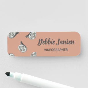 Video tapes gray pattern beige name tag