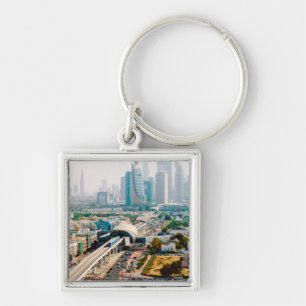 View of city metro line and skyscrapers keychain