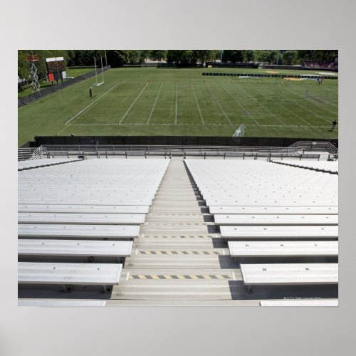 View of football field from empty bleachers poster