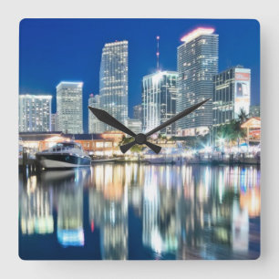 View of skyline with reflection in water, Miami Square Wall Clock