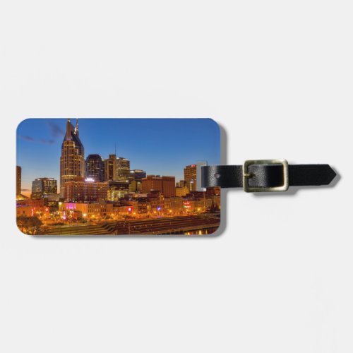 View of the city skyline at dusk luggage tag