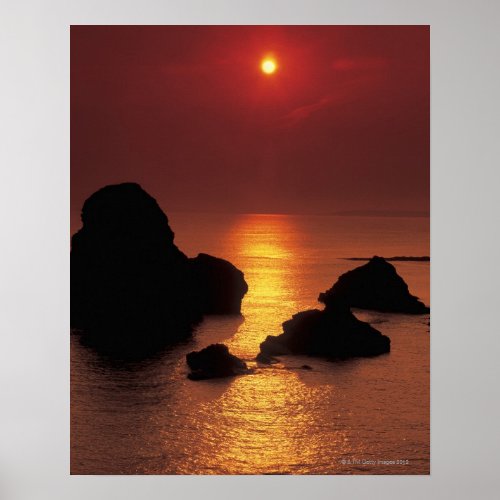 view of the sun setting over the sea poster