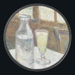 Vincent van Gogh Absinthe Famous Painting Hockey Puck<br><div class="desc">"Still Life with Absinthe" by Vincent van Gogh is a poignant exploration of the mysterious and intoxicating qualities associated with absinthe, a potent liquor popular during the late 19th century. The painting features a glass of absinthe placed on a table alongside a carafe, sugar cube, and slotted spoon, which were...</div>