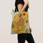 Vincent van Gogh's Stilleben Sunflowers Tote Bag<br><div class="desc">1888. Stilleben mit 12 Sonnenblumen or Vase with 12 sunflowers. Vincent Willem van Gogh was a post-Impressionist painter of Dutch origin whose work—notable for its rough beauty,  emotional honesty,  and bold color—had a far-reaching influence on 20th-century art.</div>