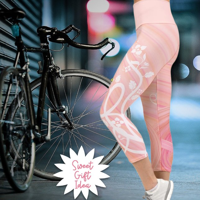 Vines and Flowers Over Peach and Pink Spirals Capri Leggings (Enjoy the comfort of these eco-polyester spandex blend pink and peach spiral capri leggings.)