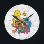 Vintage 123 Sesame Street Round Clock<br><div class="desc">This fun vintage graphic features all your favorite Sesame Pals; Bert & Ernie,  Elmo,  Big Bird & Elmo.     Room décor items; not a toy. ©  2014 Sesame Workshop. www.sesamestreet.org</div>